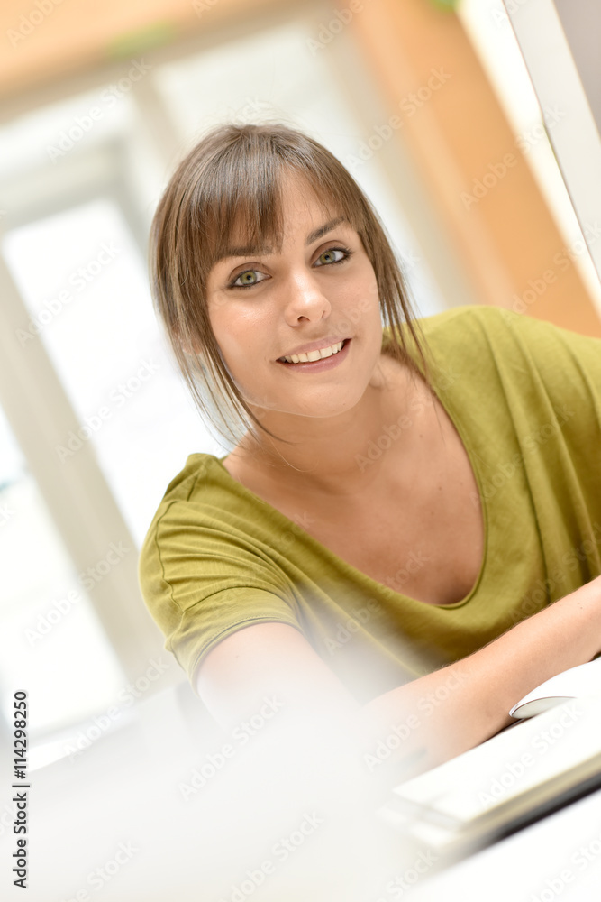 Portrait of office worker in front of desktop Portrait of office worker in front of desktop