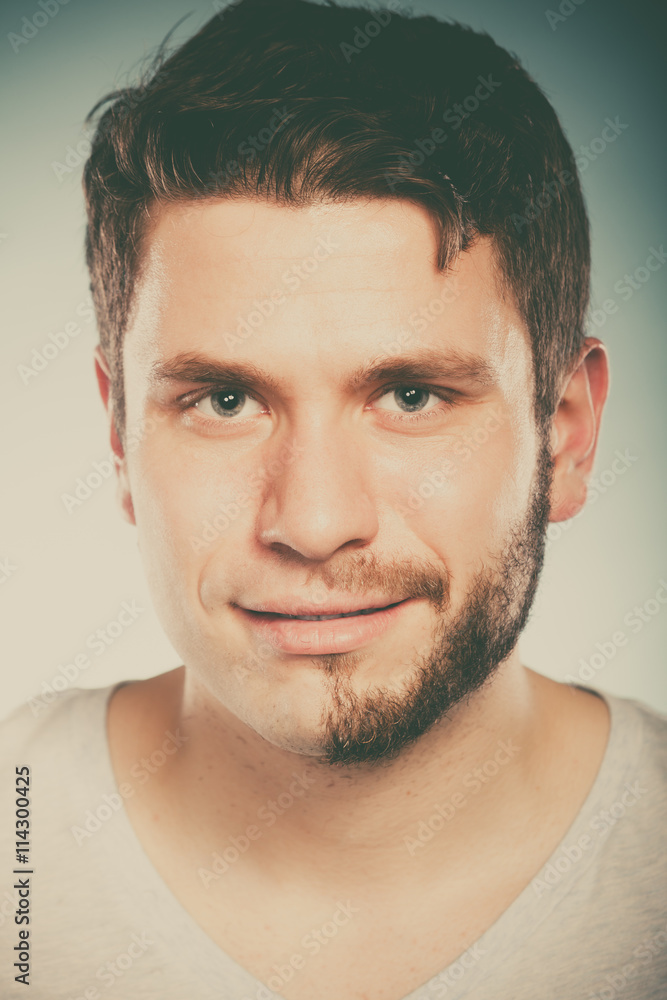 Obraz premium Young man with half shaved face beard hair.