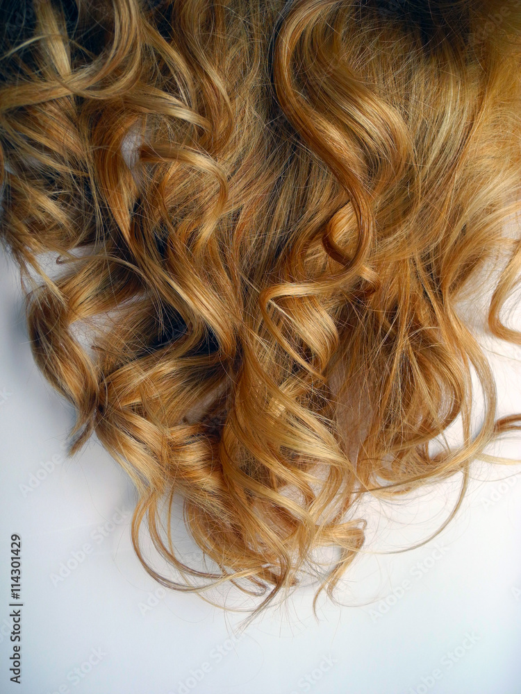 Naklejka premium Women's curls close-up.