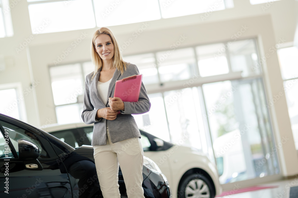Professional salesperson in car dealership Professional salesperson in car dealership