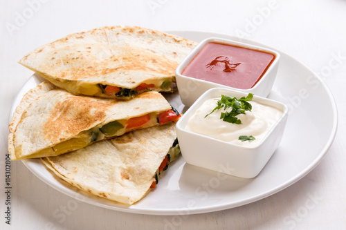 quesadilla slices on white plate