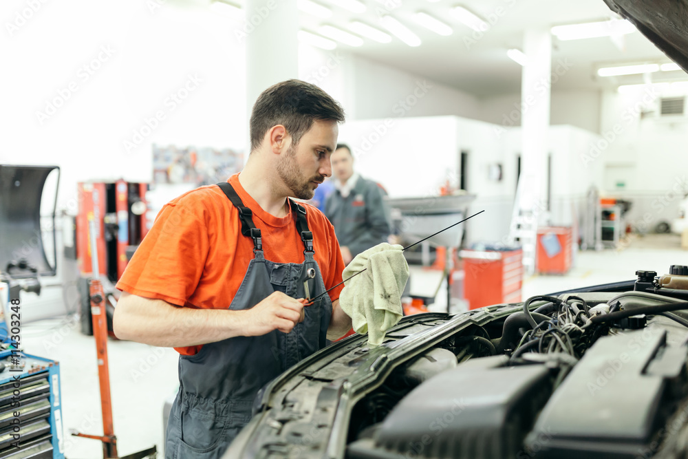 Car mechanic fixing a car