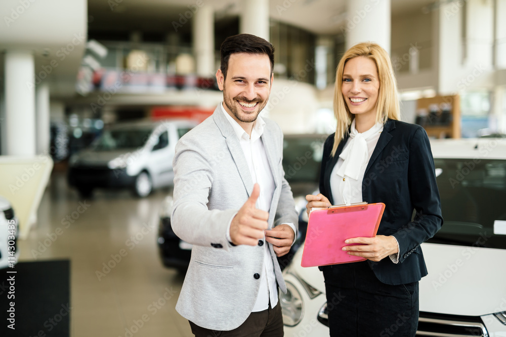 Professional salesperson in car dealership Professional salesperson in car dealership