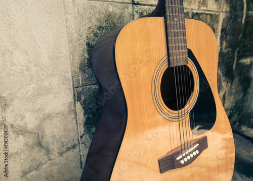 detail of classic guitar with grunge background