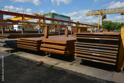 Steel plate. Metal sheet. Hot-rolled flat steel. Metal leaf. Rusty ferrum. Heavy steel plates. Metal sheets in warehouse.