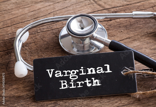 Varginal Birth words written on label tag with Stethoscope on wood as medical concept