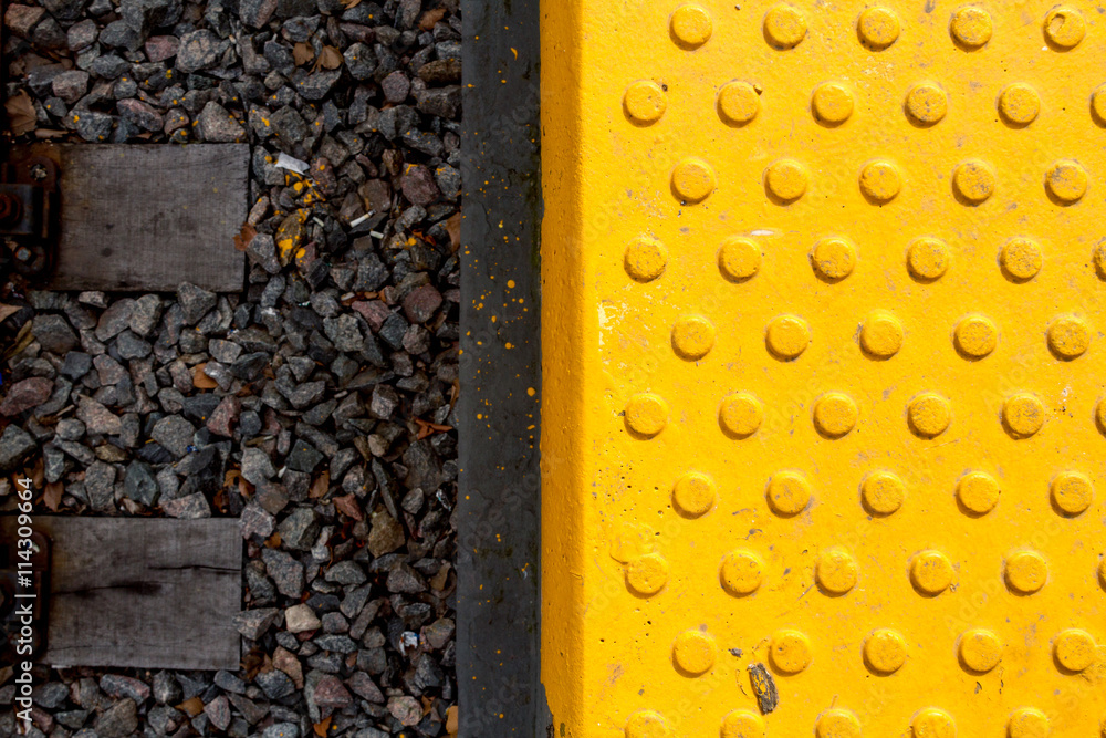 Fototapeta premium Warning tiles and railway track