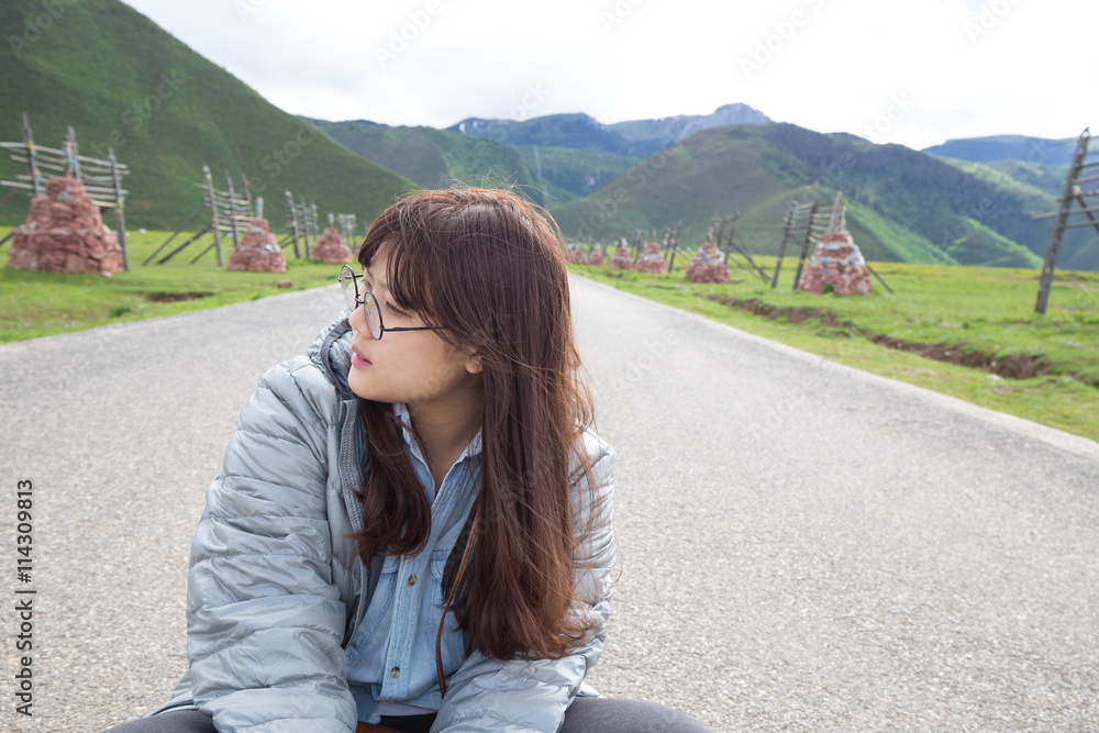 Asian girl sitting on the road Asian girl sitting on the road