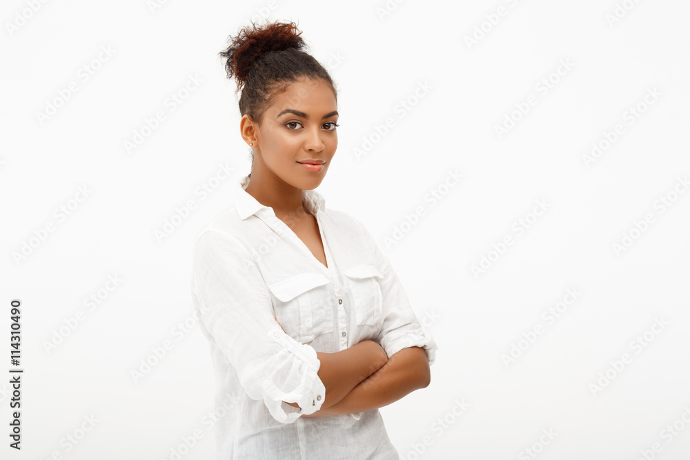 Portrait of young beautiful african girl over white background. Portrait of young beautiful african girl over white background.