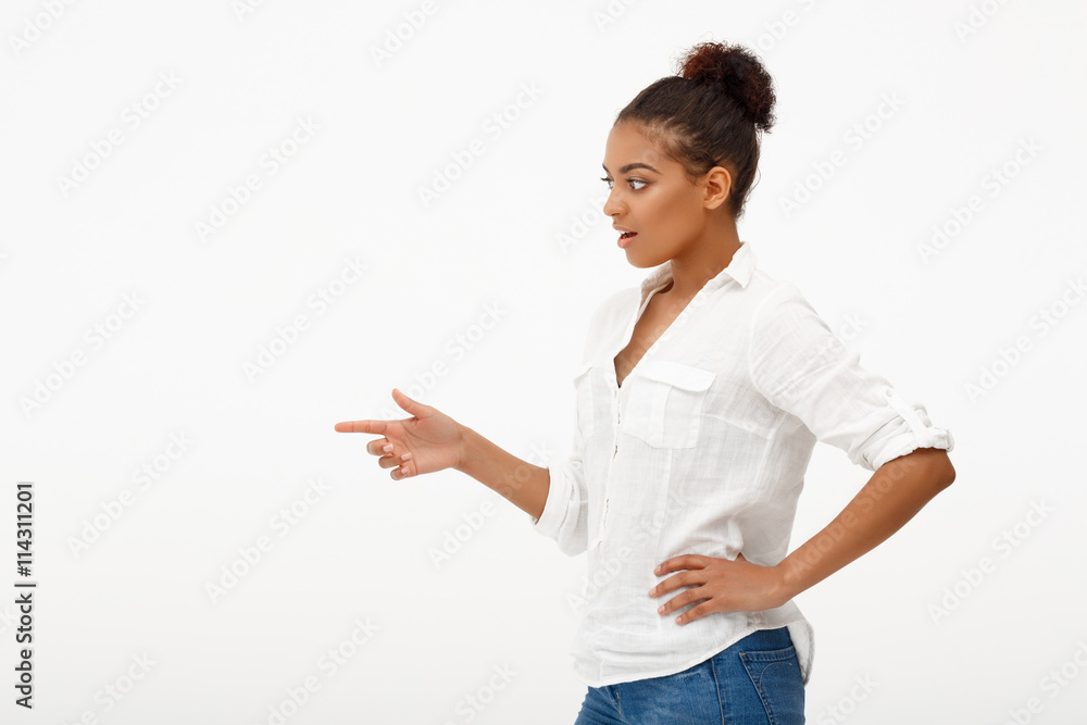 Portrait of young beautiful african girl over white background. Portrait of young beautiful african girl over white background.