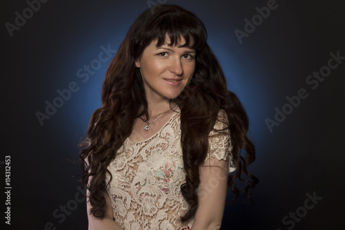 Smiling young woman with curly hair