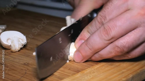 Knife Cut Mushrooms Cooking - cutting mushrooms in the kitchen. photo