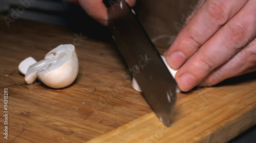 Knife Cut Mushrooms Cooking - cutting mushrooms in the kitchen. photo