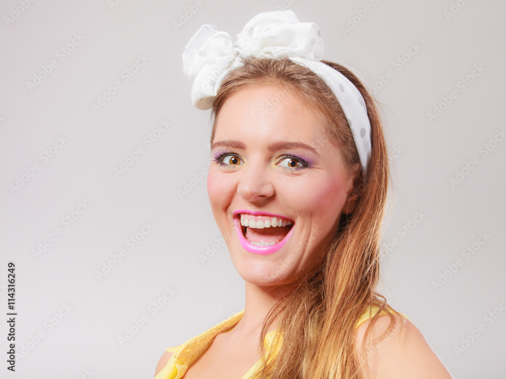 Portrait of happy pretty pin up girl with bow. Portrait of happy pretty pin up girl with bow.