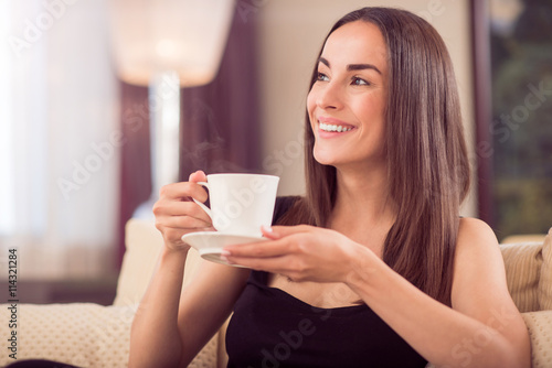 Beautiful woman holding cup of coffee