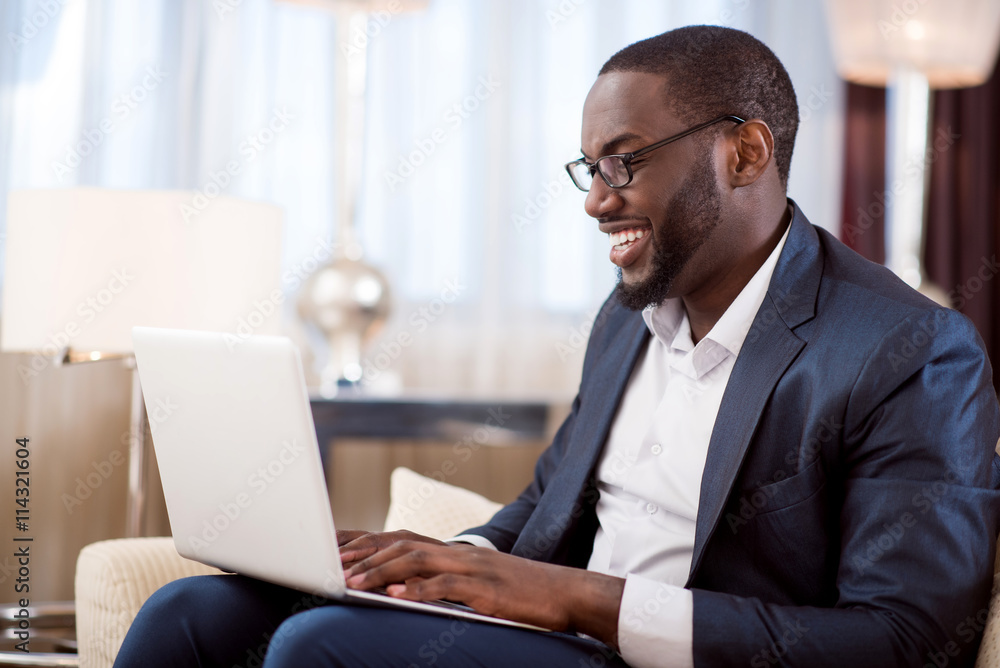 Profile of man working on laptop Profile of man working on laptop