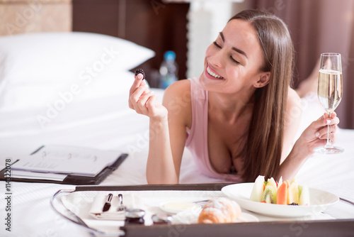 Woman eating fruit in the hotel