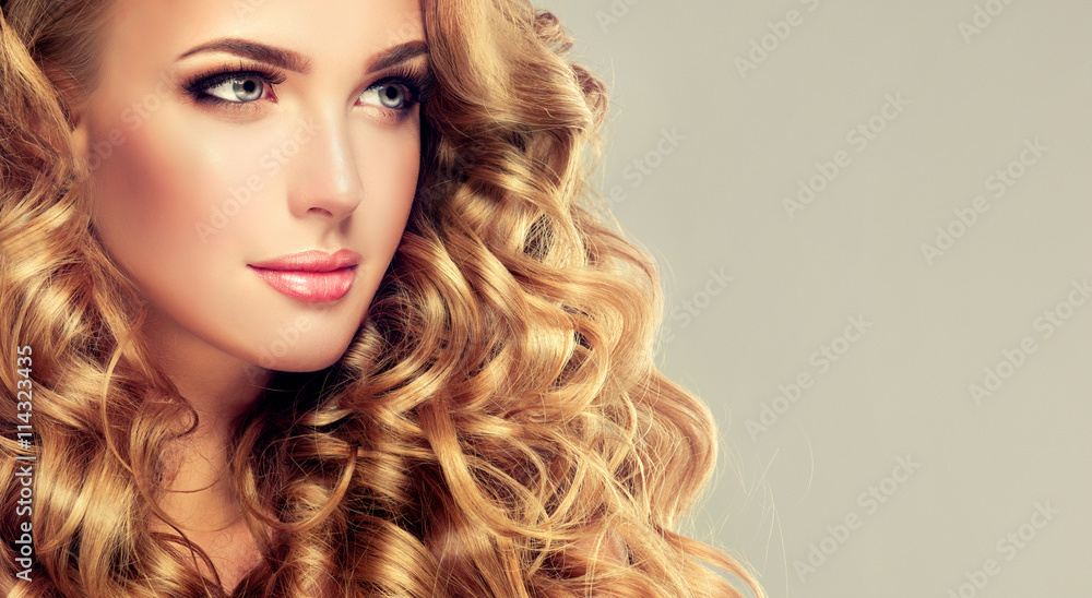 Beautiful girl with long wavy hair . Blonde model with curly hairstyle ...