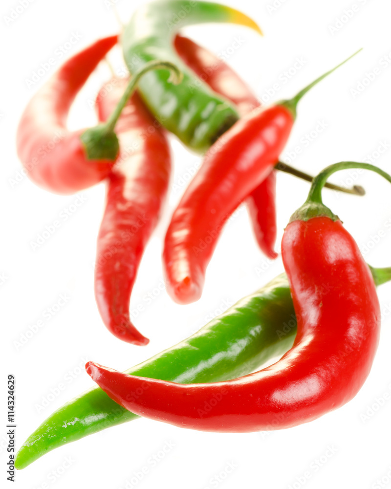 Red and green chili peppers isolated on white