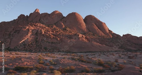 4K panning shot of the granite peaks of the Spitzkoppe mountains photo