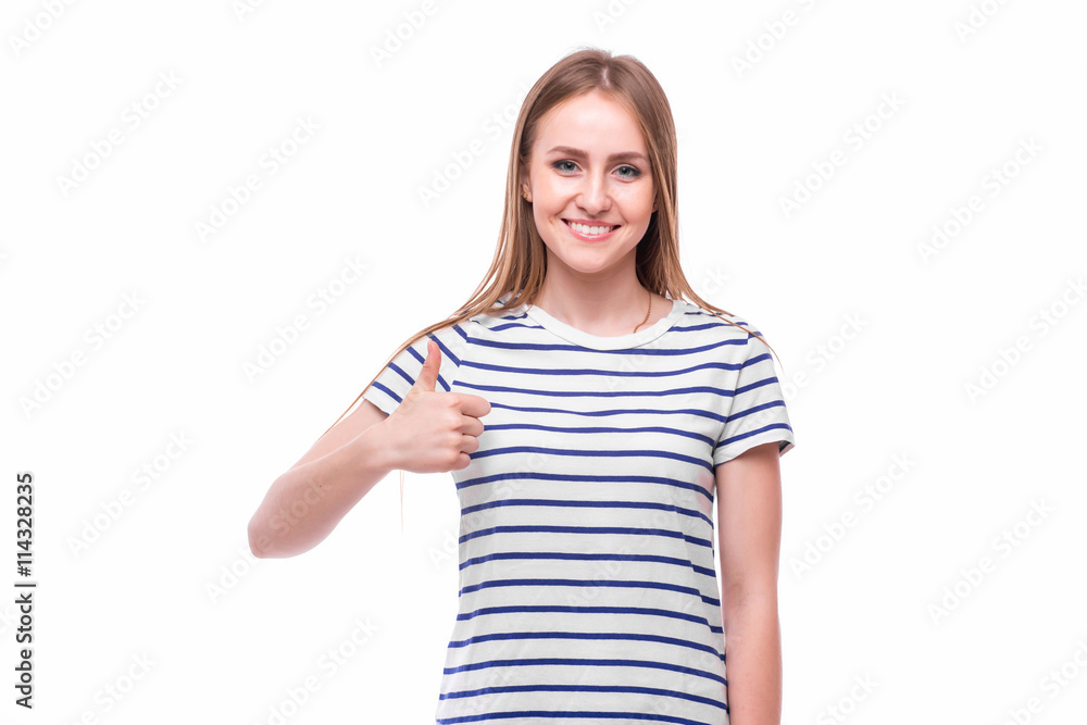 Fototapeta premium Girl with thumbs up on white background. People emotions concept.