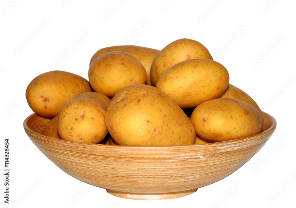 New potato in wood bowl isolated on white background New potato in wood bowl isolated on white background
