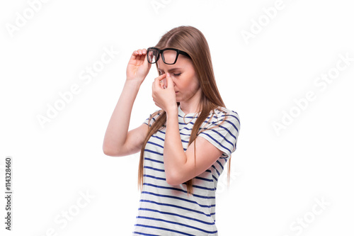 Young girl overtired on white background