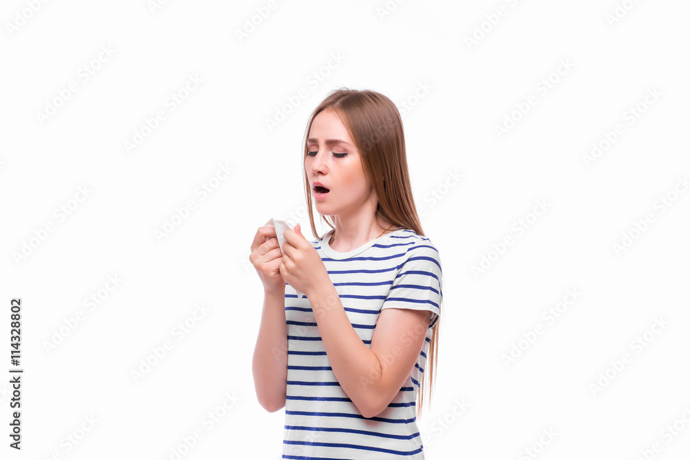 Sick woman with flu and fever blowing nose in tissue isolated over white background. Sick woman with flu and fever blowing nose in tissue isolated over white background.