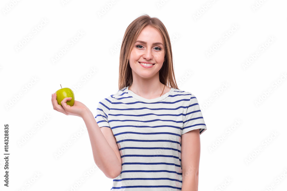 Young girl eat apple. Female teeth and apple. Healthy eating on white background Young girl eat apple. Female teeth and apple. Healthy eating on white background