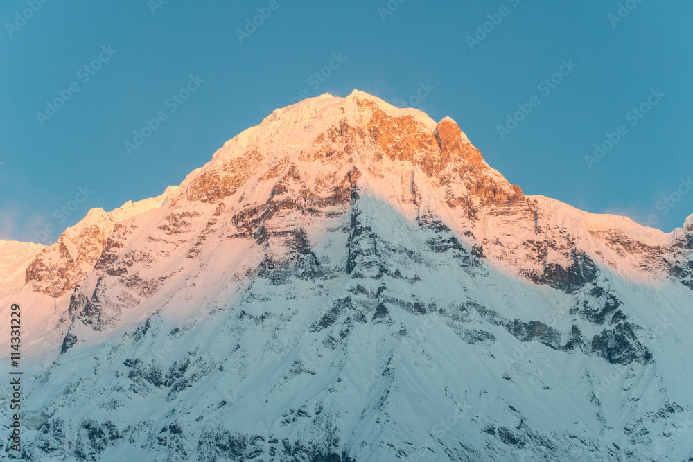 Annapurna south of himalaya mountain range in Nepal when the first sunrise shining to the peak.