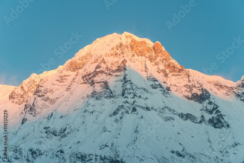 Annapurna south of himalaya mountain range in Nepal when the first sunrise shining to the peak.