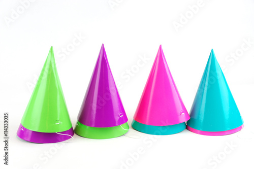 shiny party hats on white background