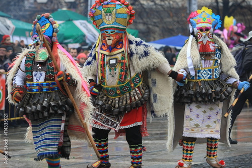 Pernik, Bulgaria - January 14, 2008: Unidentified man in traditional Kukeri costume are seen at the Festival of the Masquerade Games Surva in Pernik, Bulgaria.