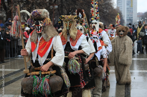 Pernik, Bulgaria - January 14, 2008: Unidentified man in traditional Kukeri costume are seen at the Festival of the Masquerade Games Surva in Pernik, Bulgaria.