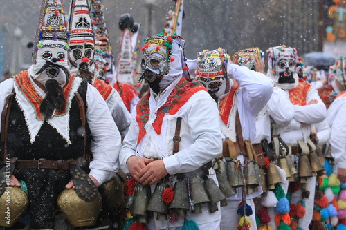 Pernik, Bulgaria - January 14, 2008: Unidentified man in traditional Kukeri costume are seen at the Festival of the Masquerade Games Surva in Pernik, Bulgaria. © georgidimitrov70