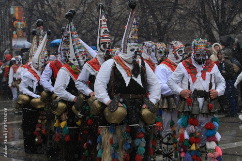 Pernik, Bulgaria - January 14, 2008: Unidentified man in traditional Kukeri costume are seen at the Festival of the Masquerade Games Surva in Pernik, Bulgaria.