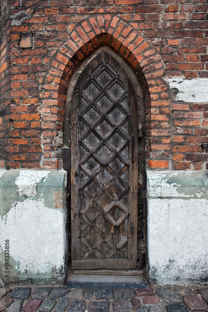 Narrow Gothic Wooden Door To A Church