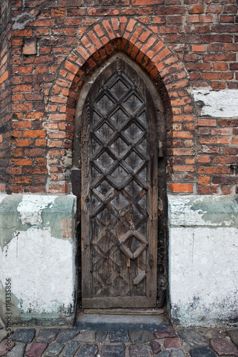 Narrow Gothic Wooden Door To A Church