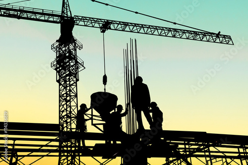 Construction workers and engineers working on high security near