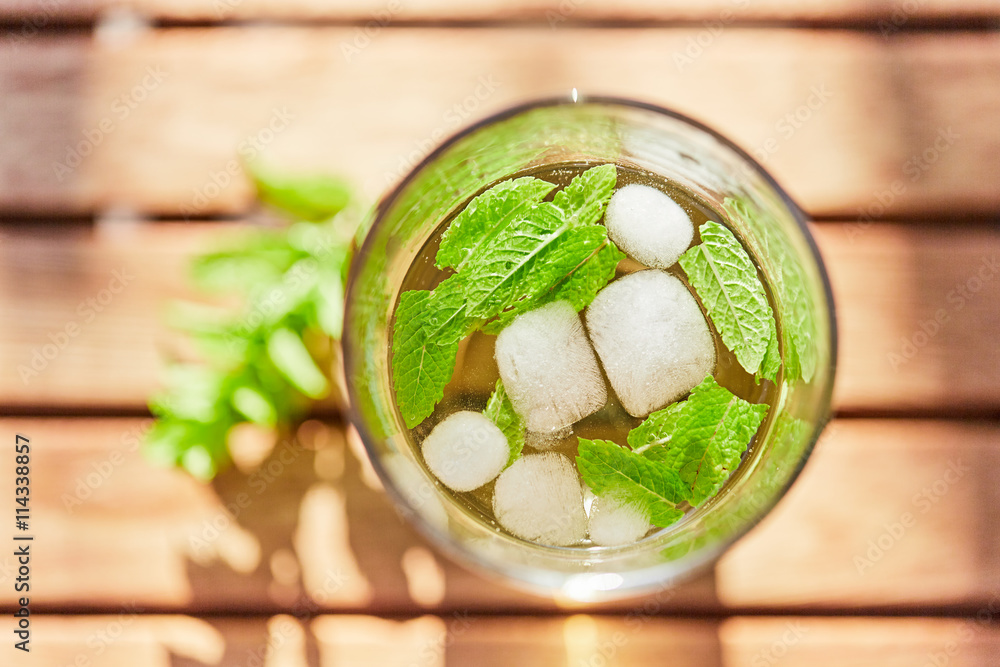 Cool drink with mint and ice on table top view Cool drink with mint and ice on table top view