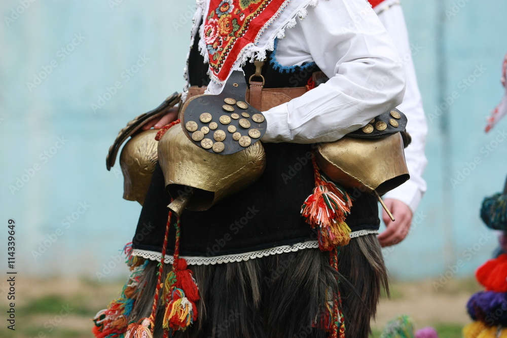 Pernik, Bulgaria - January30, 2010: Unidentified man in traditional Kukeri costume are seen at the Festival of the Masquerade Games Surva in Pernik, Bulgaria.