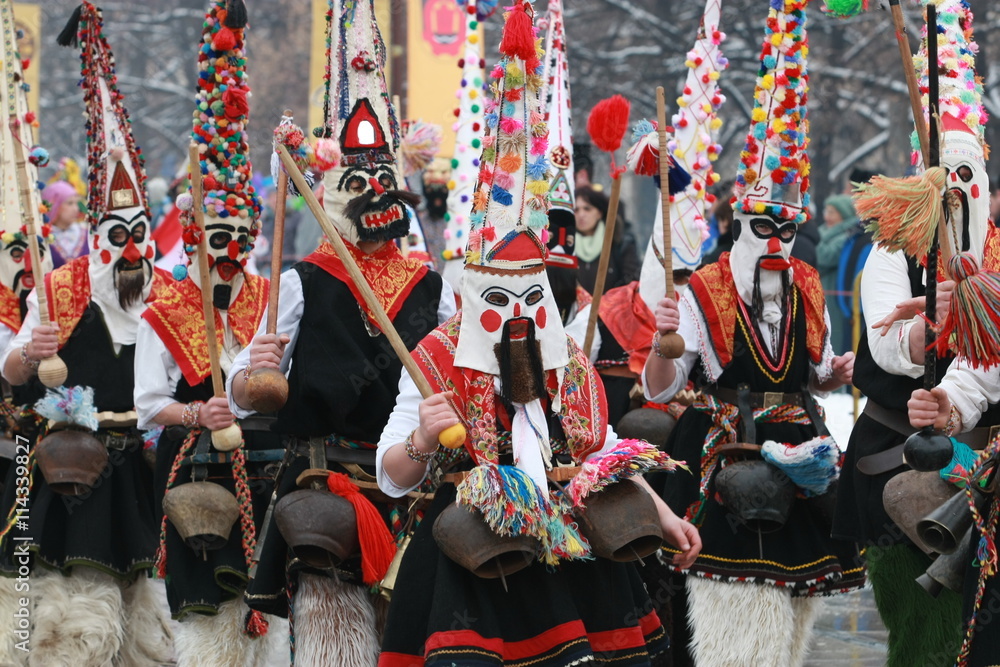 Pernik, Bulgaria - January30, 2010: Unidentified man in traditional Kukeri costume are seen at the Festival of the Masquerade Games Surva in Pernik, Bulgaria.