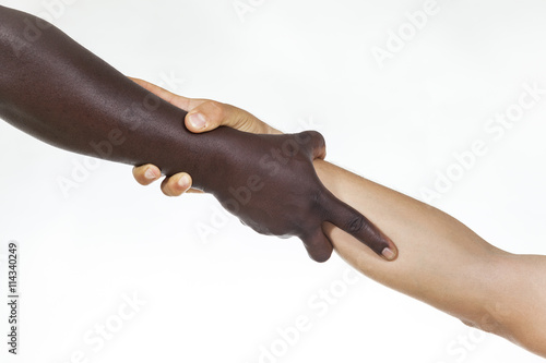 Interracial forearm shake, helping , humanity and brotherhood concept. White background