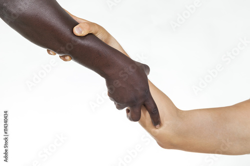 Interracial forearm shake,  helping , humanity and brotherhood concept. White background