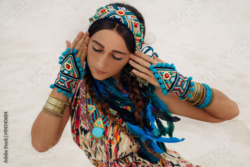 фотографія attractive young woman in ethnic jewelry outdoors