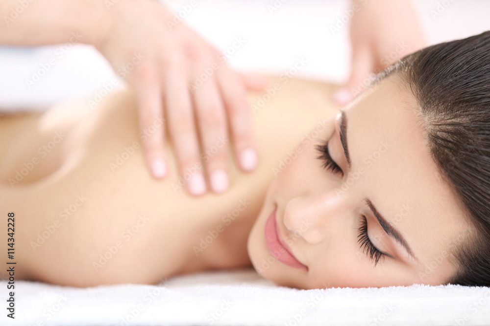 Young woman having massage in spa salon Young woman having massage in spa salon