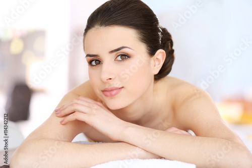 Young woman relaxing in spa center