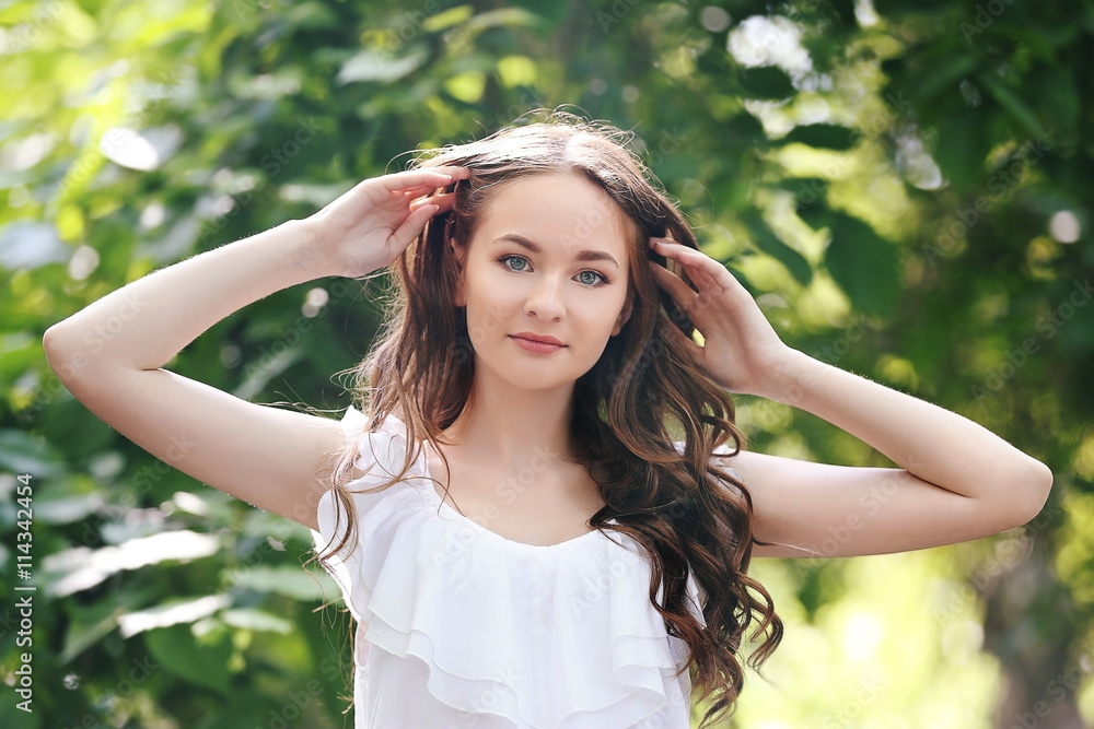Beautiful girl relaxing in green park