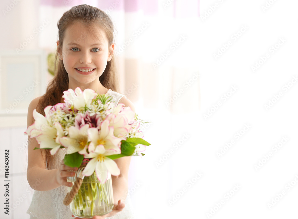 Beautiful small girl with fresh spring bouquet Beautiful small girl with fresh spring bouquet
