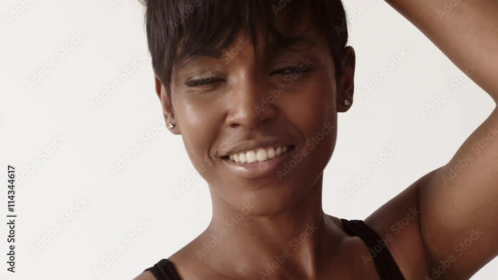 Joyful attractive girl poses on camera in black body, isolated on white with moving focus Joyful attractive girl poses on camera in black body, isolated on white with moving focus